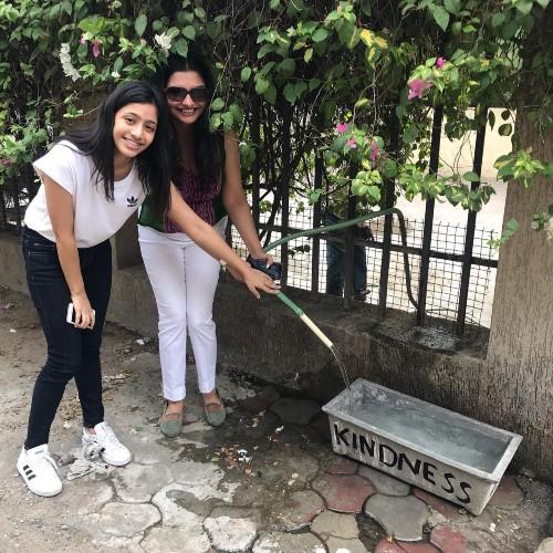 Chandani visited various areas and houses to secure permission for her team to be place water bowls for strays near their homes. Community members agreed to fill the bowls daily with clean water. (Courtesy Chandani Grover)