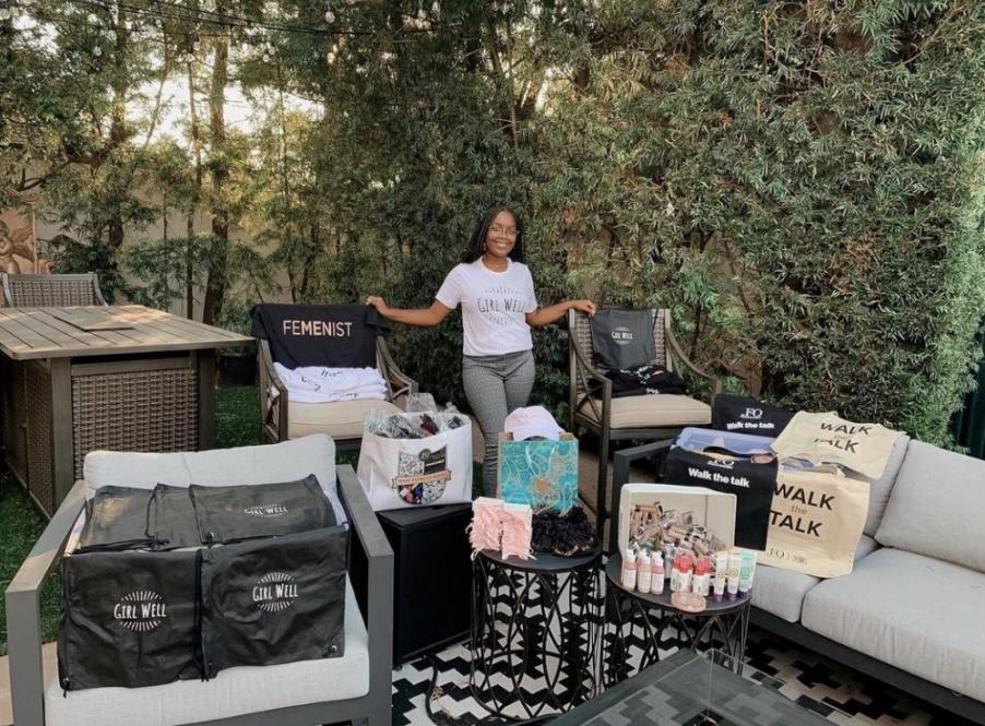 Girl posing with bags and boxes 